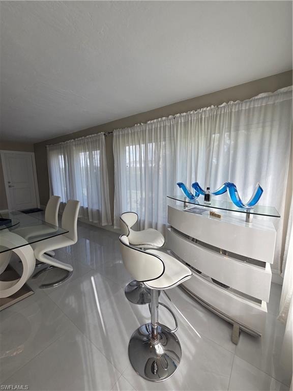 Misc room with tile patterned floors