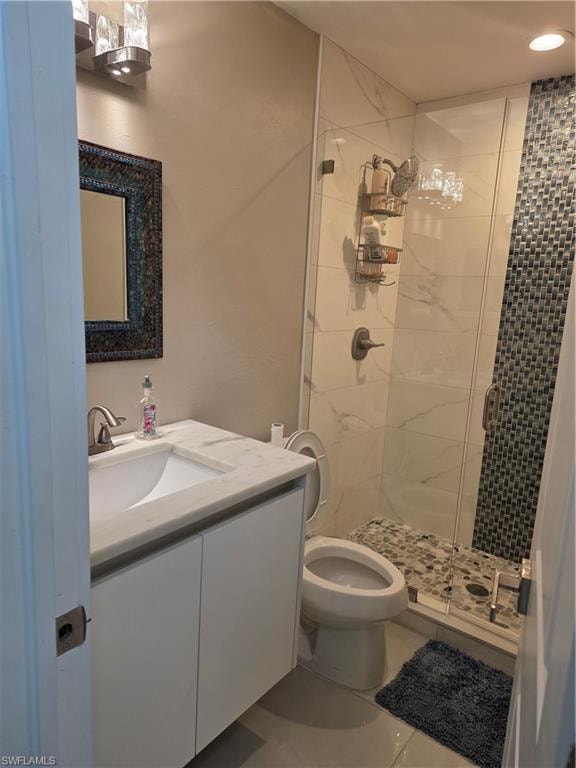 Bathroom with vanity and a shower stall