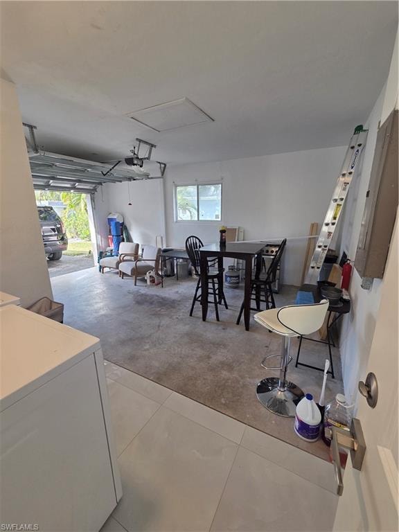 Garage featuring washer / clothes dryer and a central vacuum unit