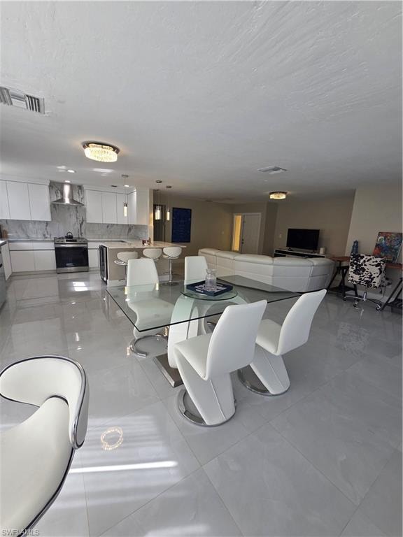 Dining room with light tile patterned floors