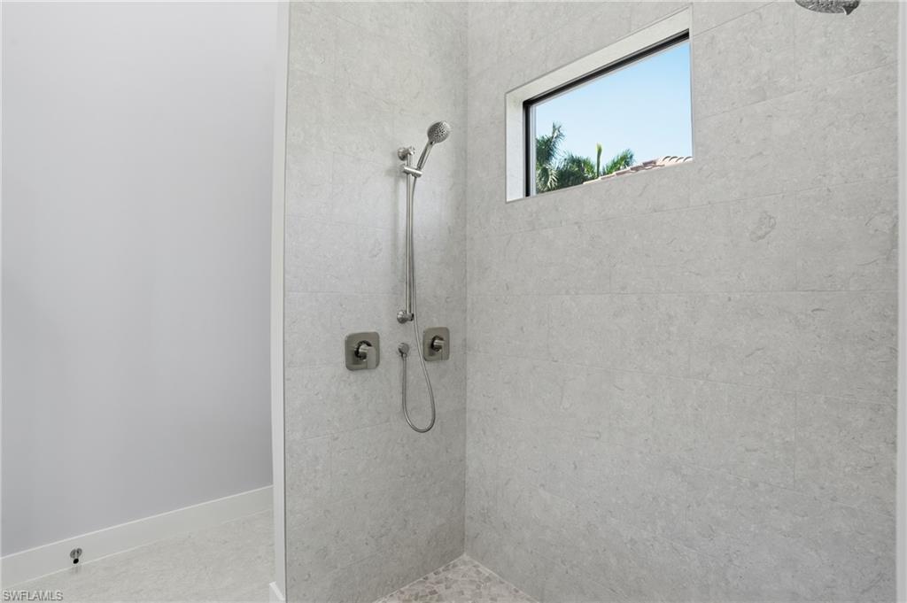 Full bathroom with a tile shower