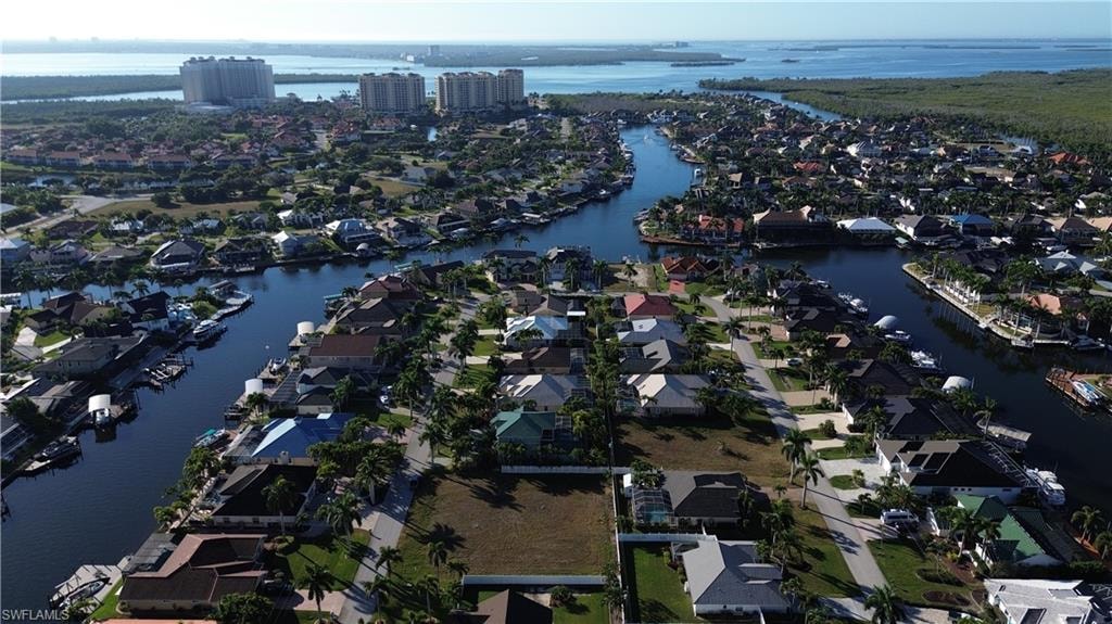 Aerial view of property's location featuring nearby suburban area