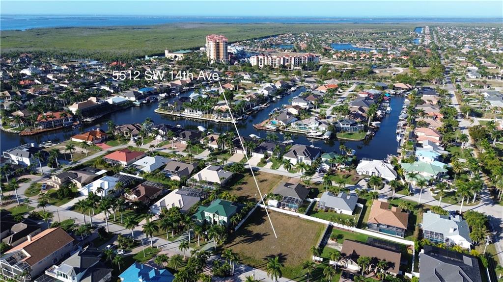 Aerial overview of property's location featuring nearby suburban area