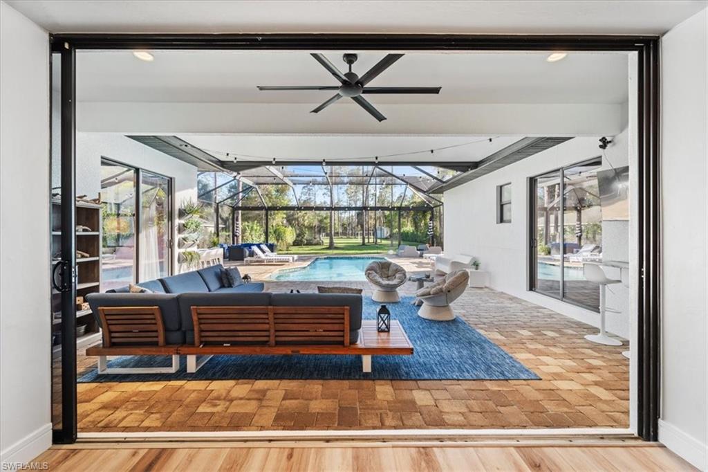 Triple slider open from living room to lanai.