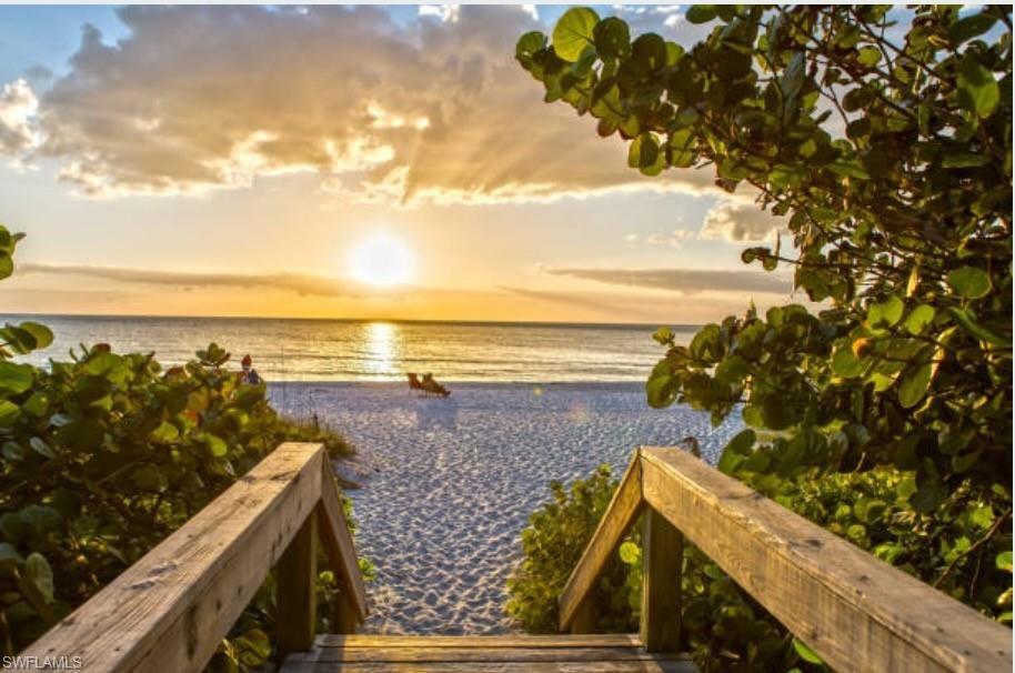Property view of water featuring a beach view