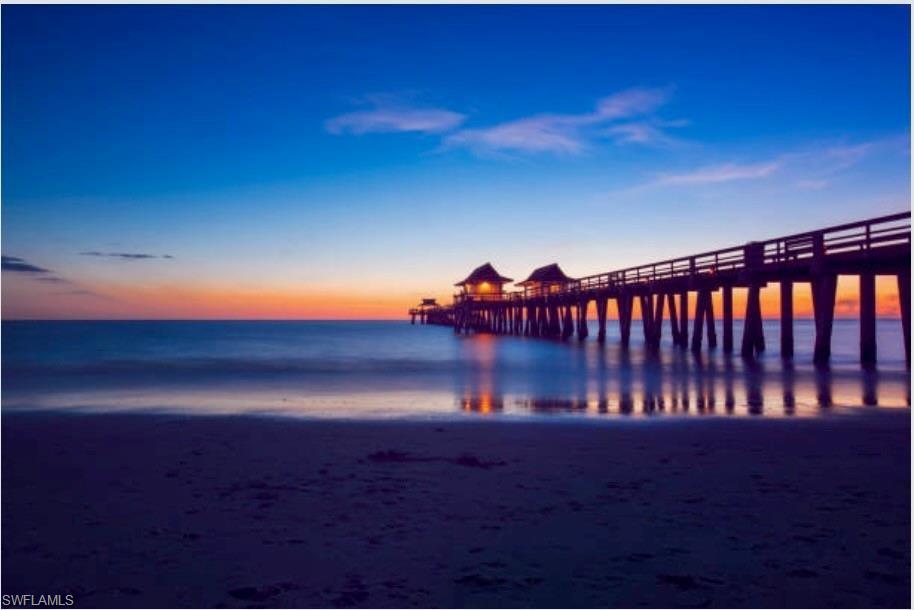 Property view of water featuring a pier
