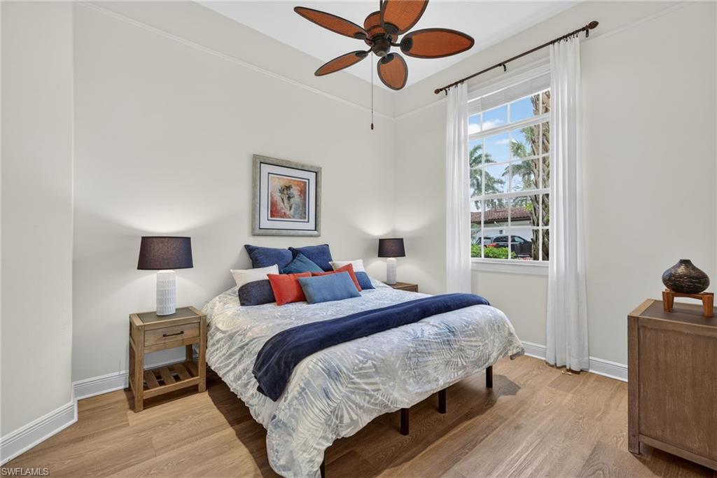 Bedroom with light wood-style floors and ceiling fan