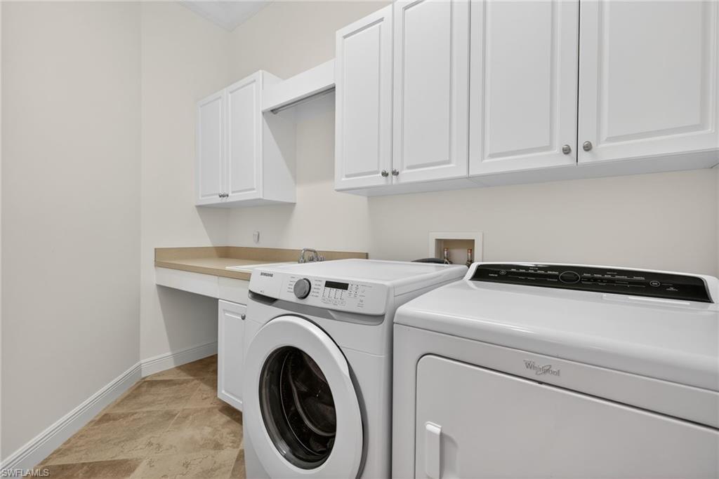 Washroom with independent washer and dryer and cabinet space