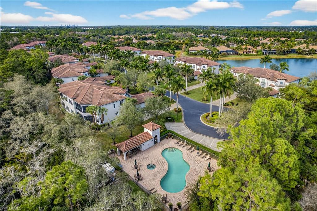 Aerial view of residential area featuring a large body of water