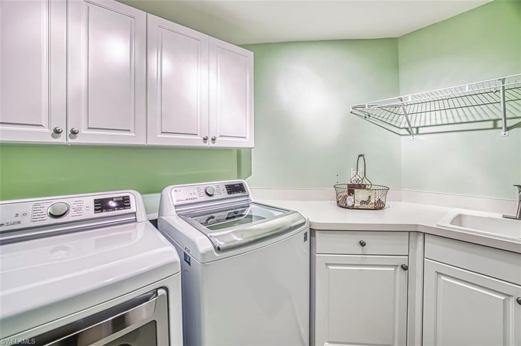 Laundry room featuring cabinet space and washing machine and dryer