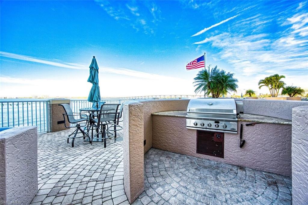 View of patio / terrace featuring grilling area and outdoor dining area