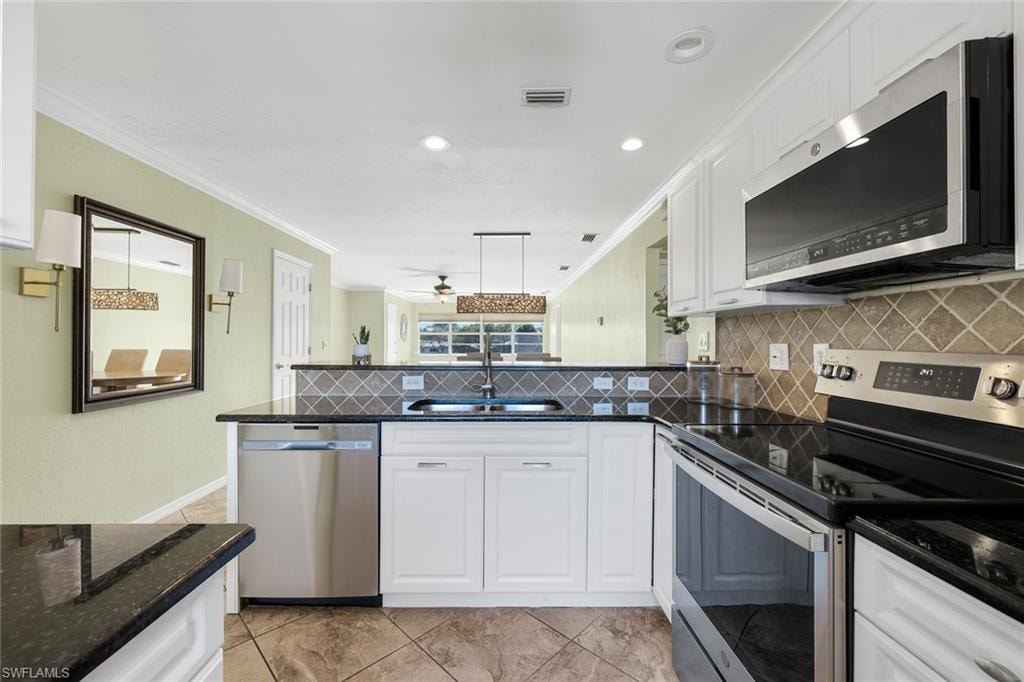Stainless appliances and granite countertops.