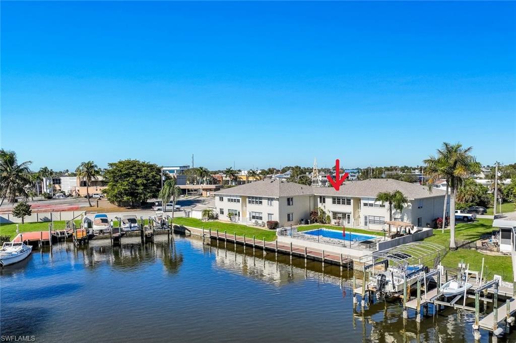 Water view with a boat dock and boat lift