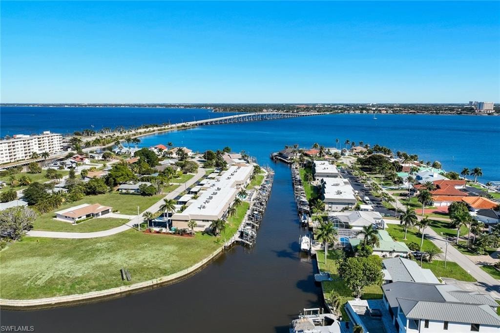 Drone / aerial view of a large body of water and a notable bridge