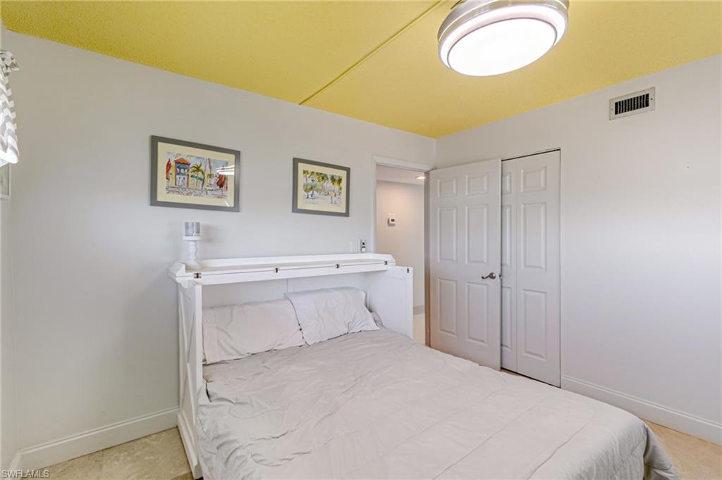 Bedroom with baseboards and a closet
