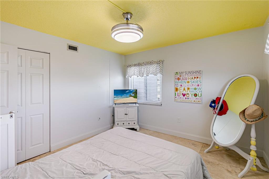 Bedroom with baseboards and a closet