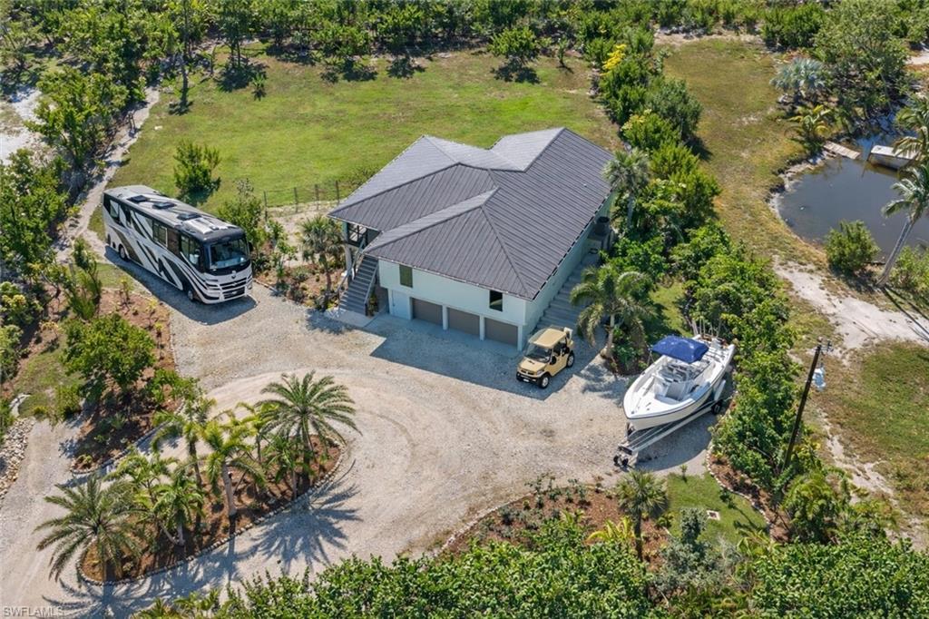 Three separate parking pads around an extra-large, spacious circular driveway. Plenty of Room for all your Big Toys