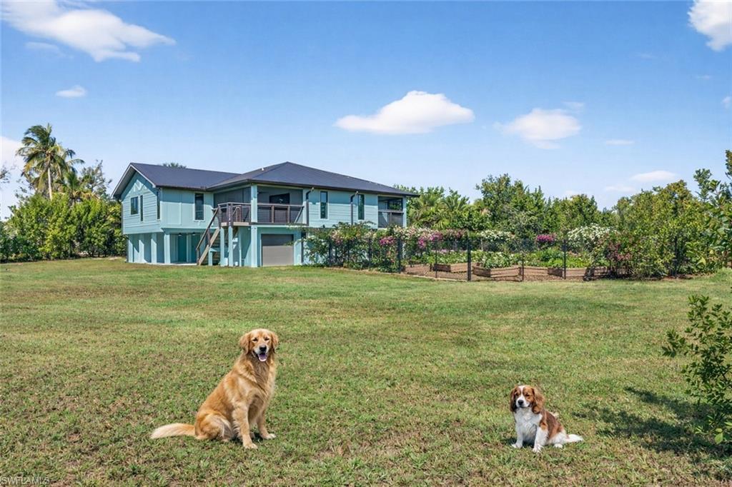 An oversized, fenced yard is perfect for pets.