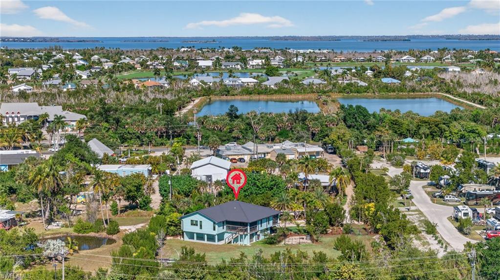 Aerial view of residential area with a large body of water