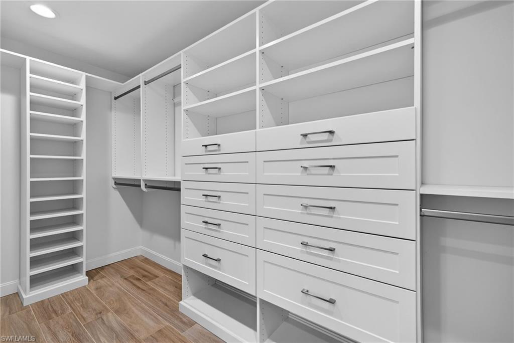 Expansive dressing room style walk in closet, custom built ins, generous storage and hanging space.