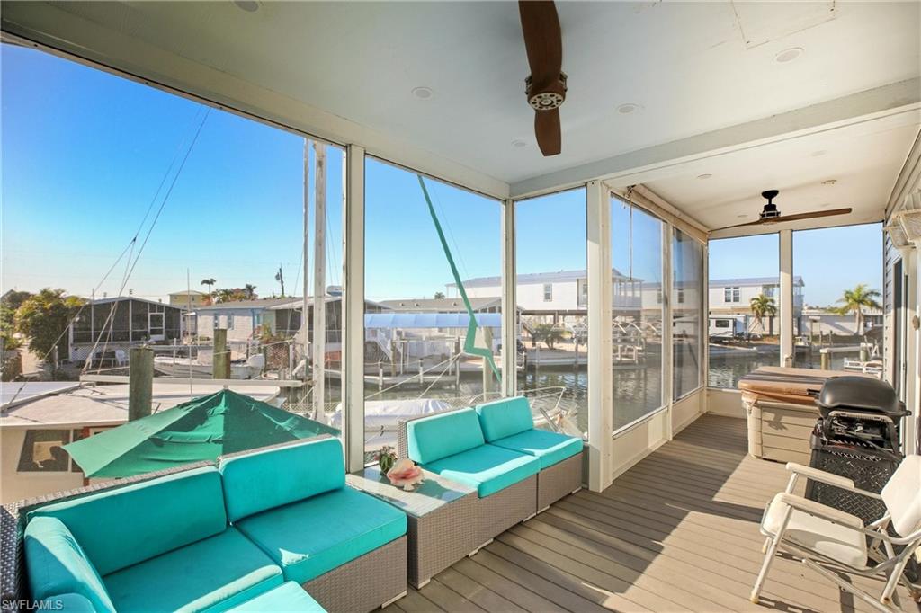 Sunroom / solarium featuring outdoor lounge area, a water view, and a residential view