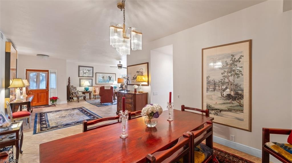 Dining room featuring a ceiling fan and light tile patterned flooring