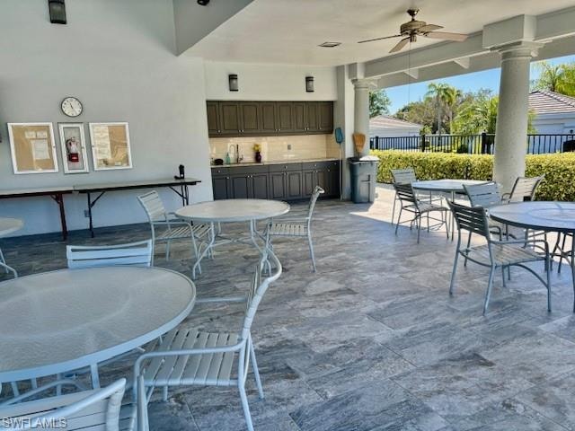 View of patio / terrace featuring outdoor dining space and a ceiling fan