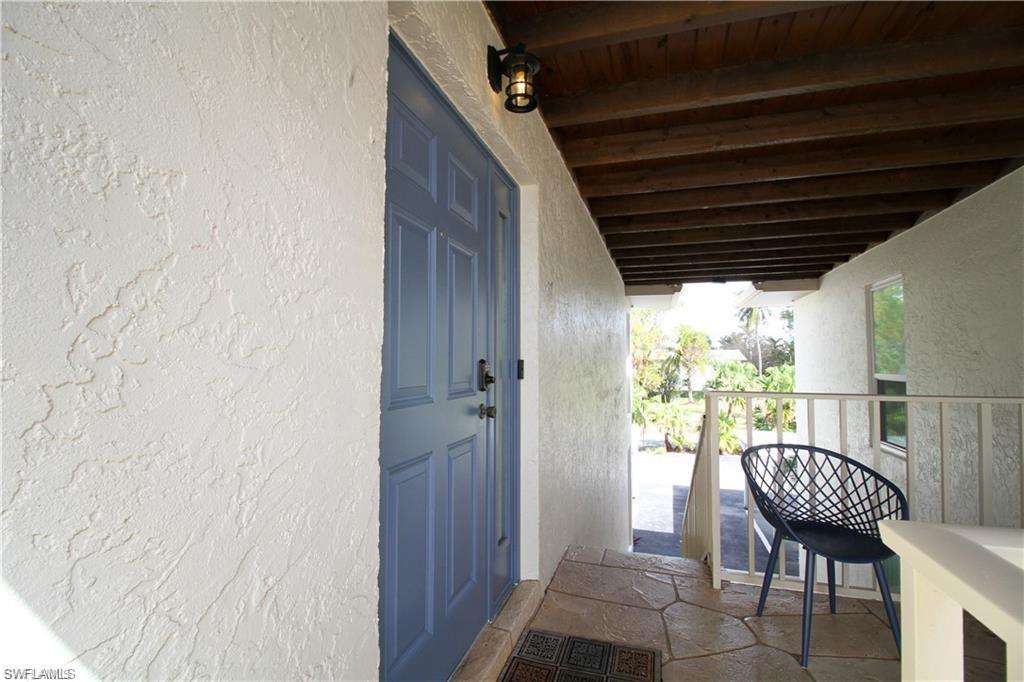 Property entrance with stucco siding