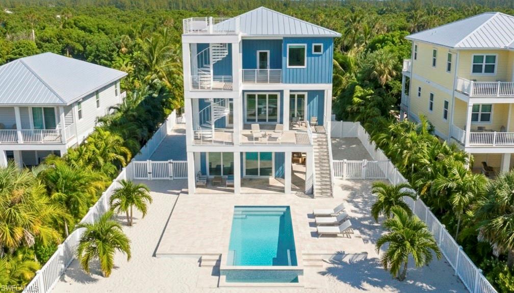 Rear 3D rendering of house with pool area, expansive decks & multiple levels - virtually enhanced