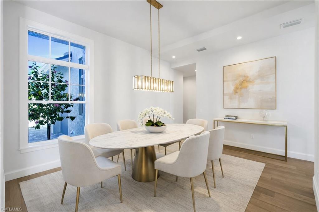 Dining area featuring light wood-style flooring and recessed lighting