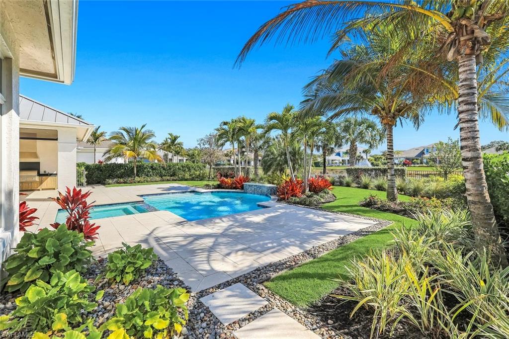 Combined pool / hot tub featuring a patio area