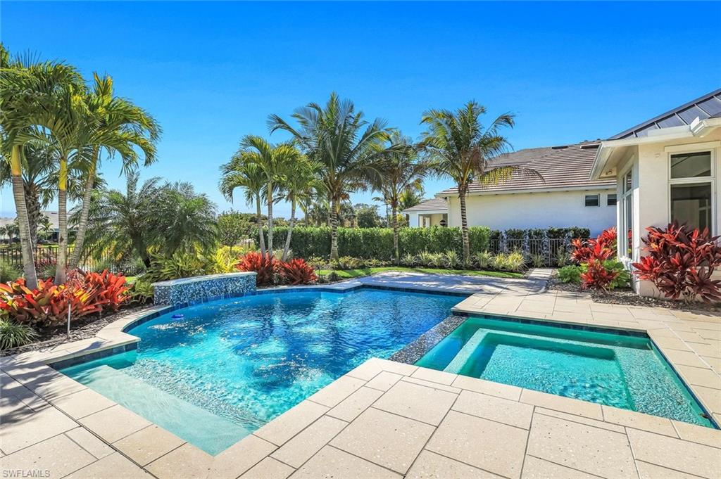 Combined pool / hot tub featuring a patio area