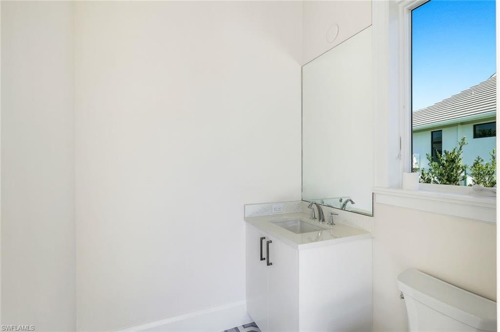 Bathroom with toilet and vanity