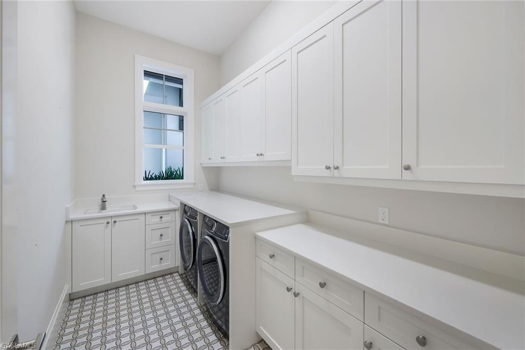 Laundry room featuring cabinet space and washing machine and dryer