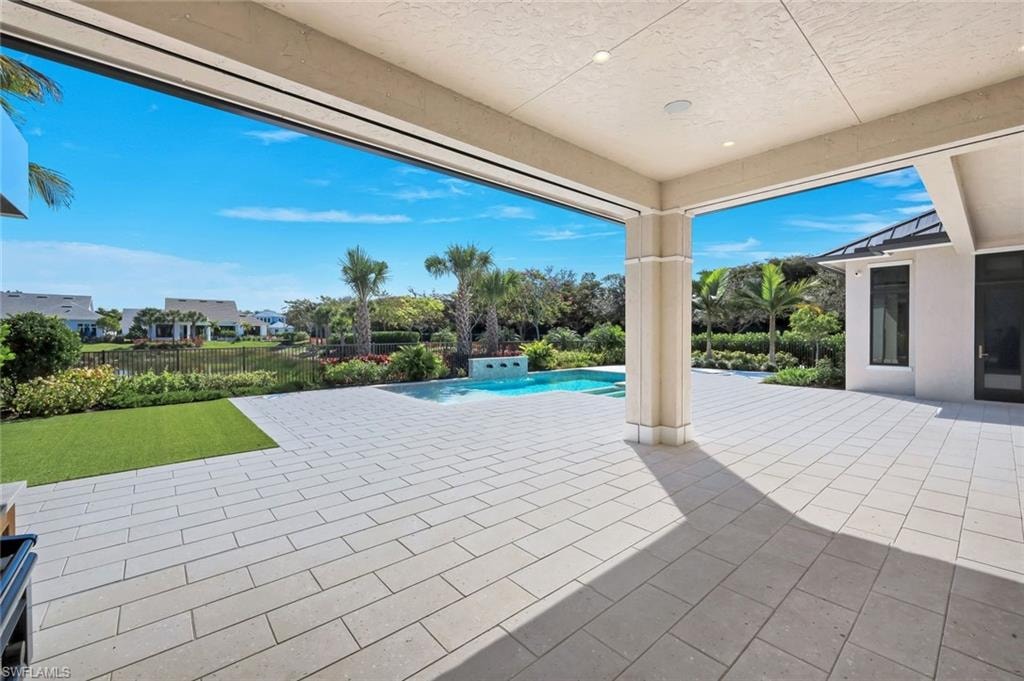 Fenced backyard with a patio