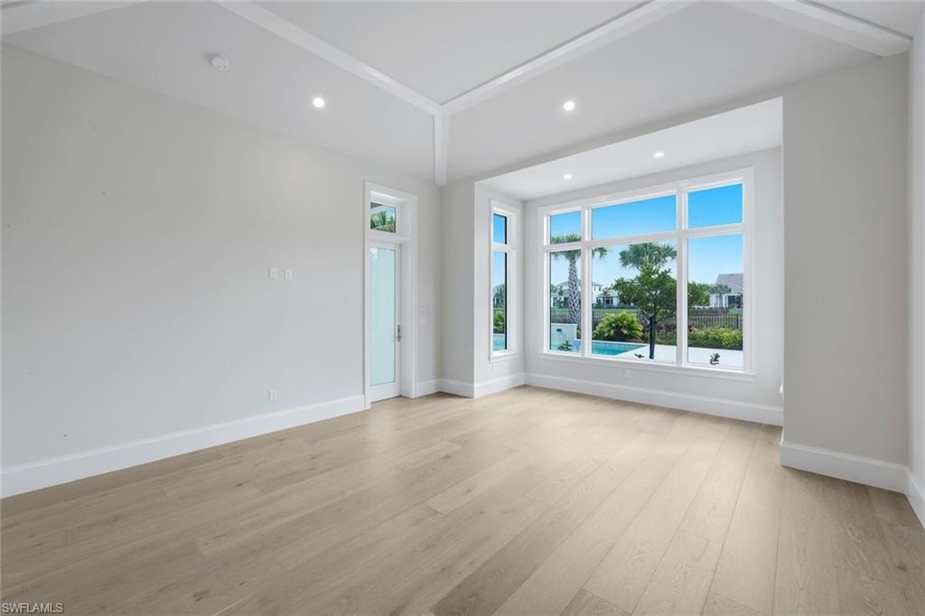 Unfurnished room featuring light wood finished floors and recessed lighting