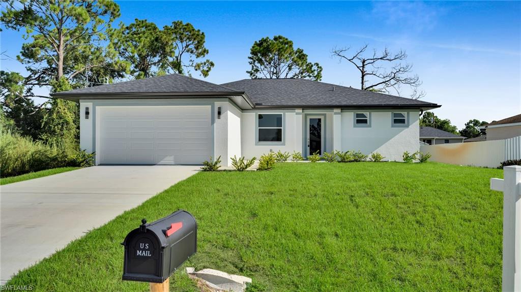 Ranch-style house featuring concrete driveway, stucco siding, an attached garage, and a shingled roof