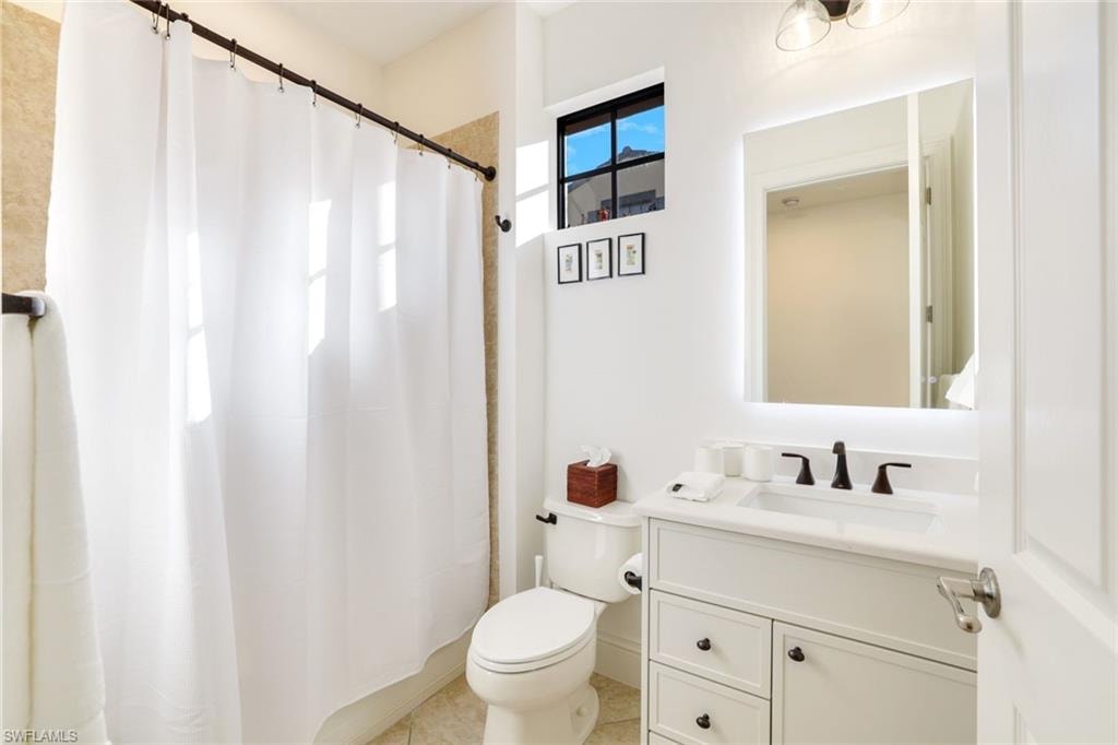 Bathroom featuring vanity and a shower with curtain