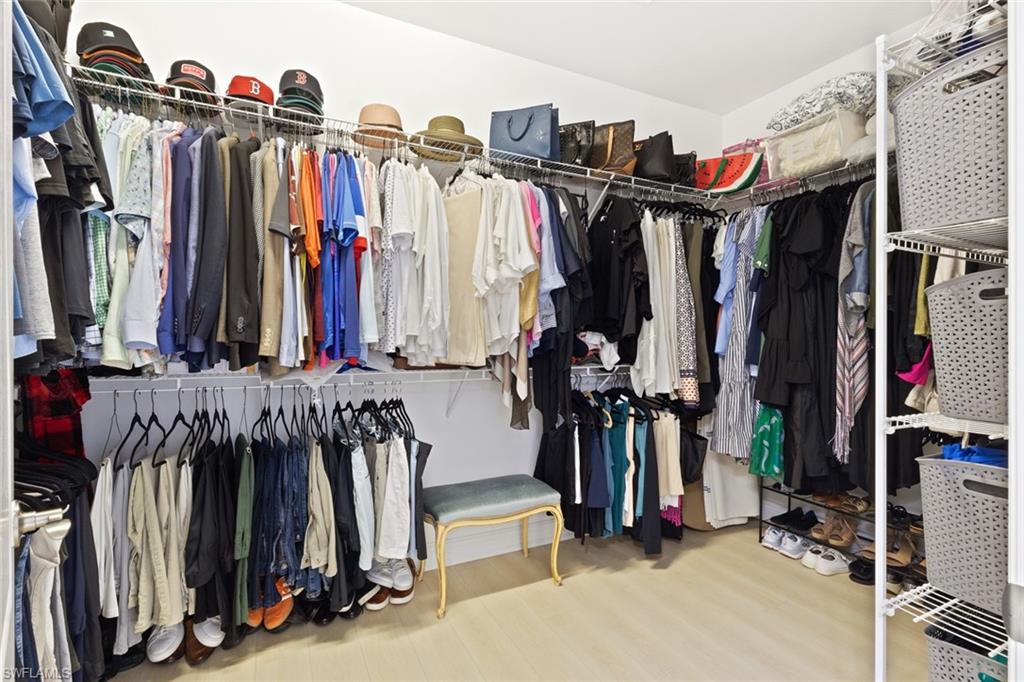 Spacious closet featuring wood finished floors