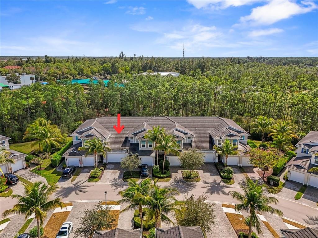 Aerial overview of property's location featuring a heavily wooded area
