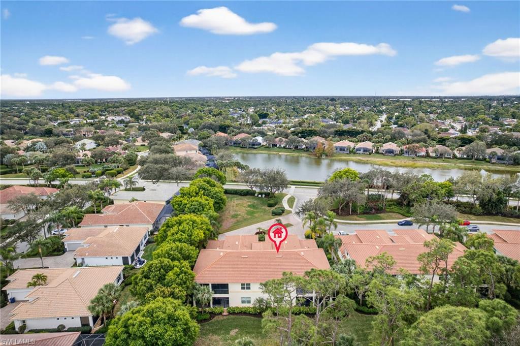 View of property location with nearby suburban area and a nearby body of water