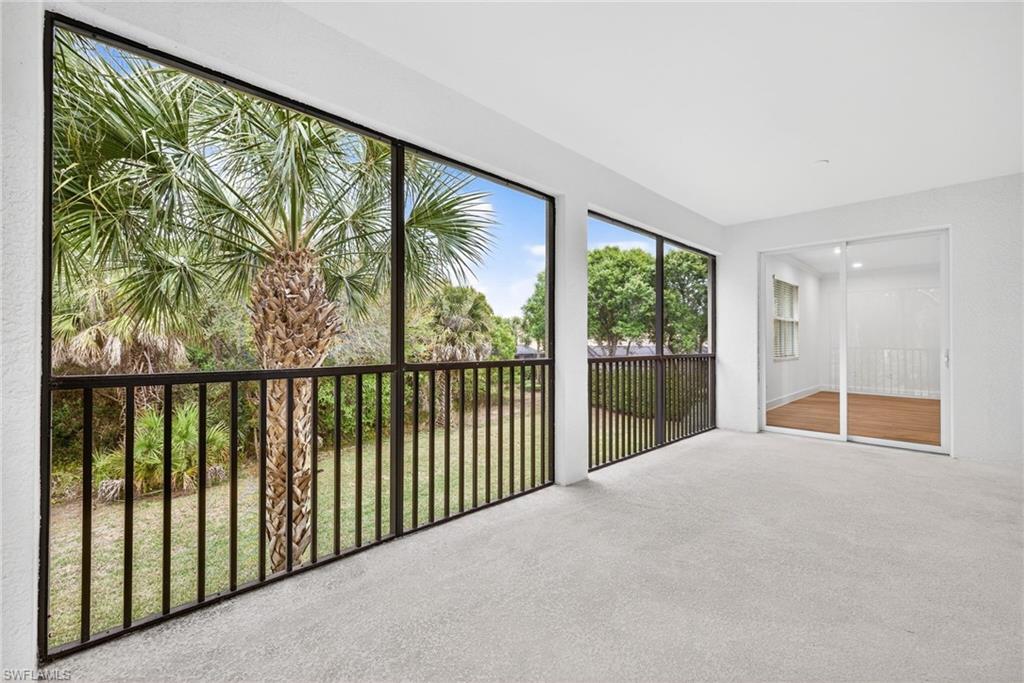 Unfurnished sunroom featuring carpet flooring