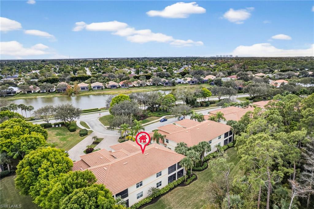 Aerial view of residential area featuring a large body of water