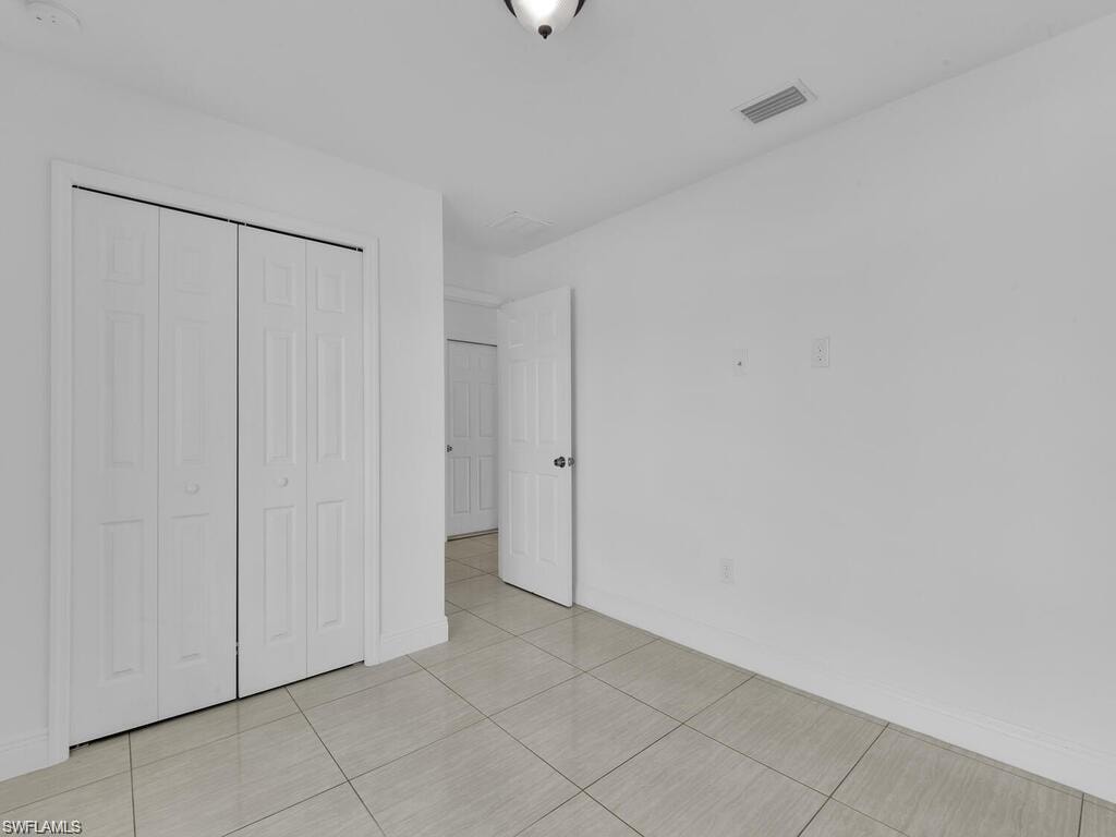 3rd Unfurnished bedroom with a closet and window facing the front of the house