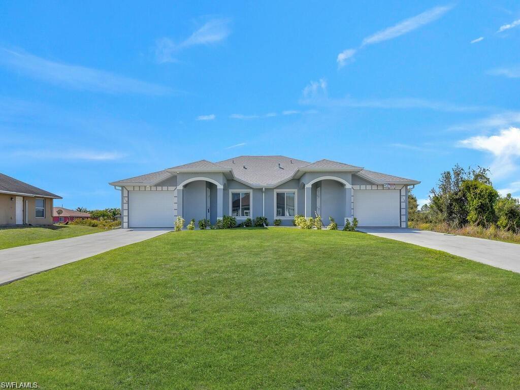 Duplex with extra long driveway, large front lawn, 1 car garage