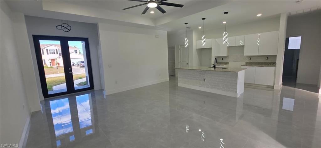 Full bath with vanity and a marble finish shower