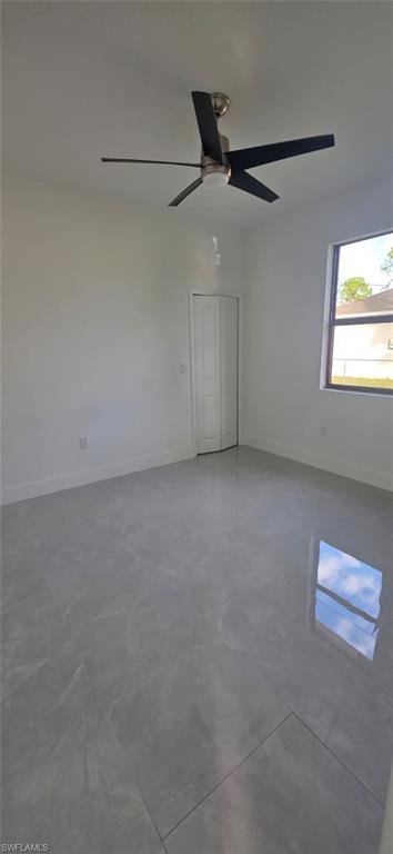 Unfurnished room with finished concrete floors