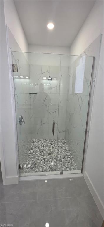 Spare room with concrete floors and ceiling fan