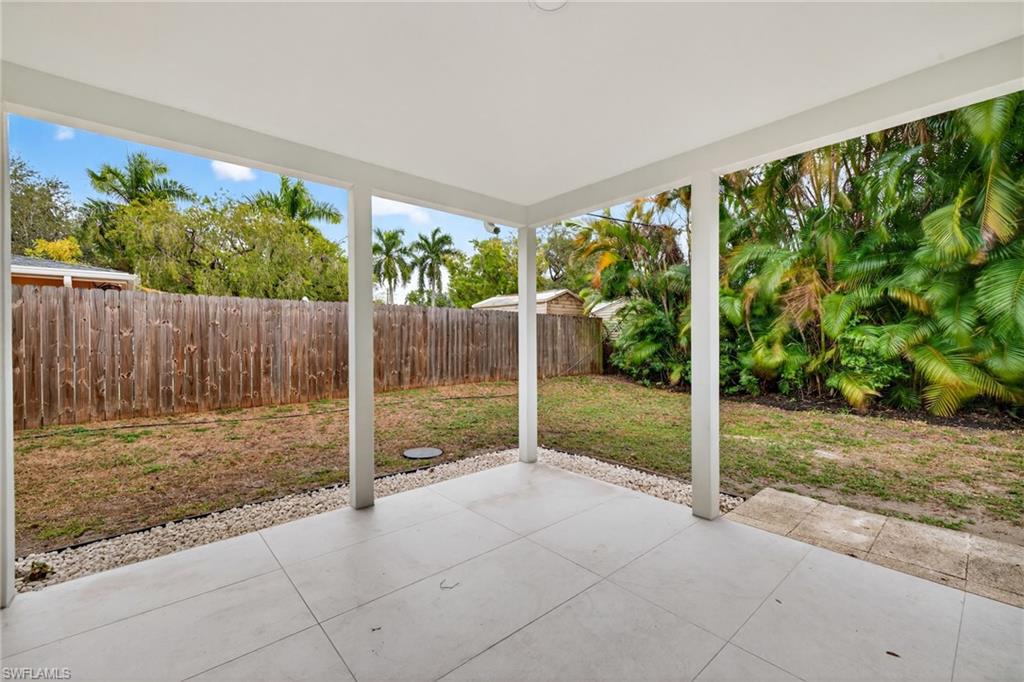 Fenced backyard with a patio