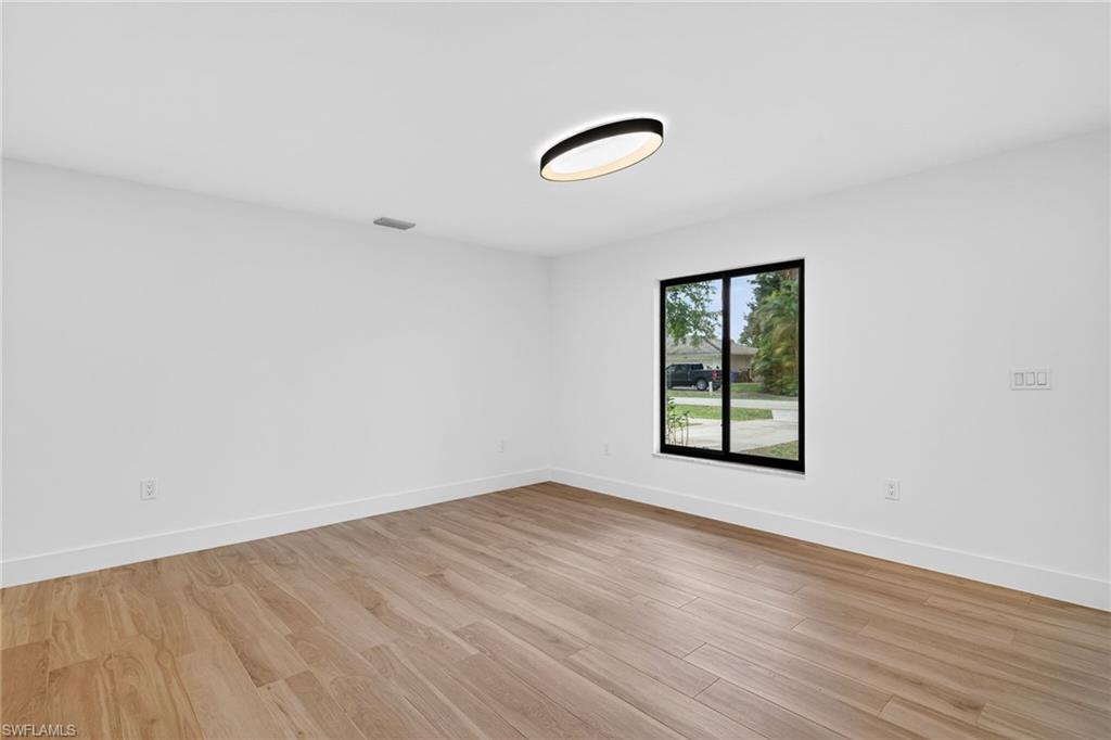 Empty room featuring light wood finished floors